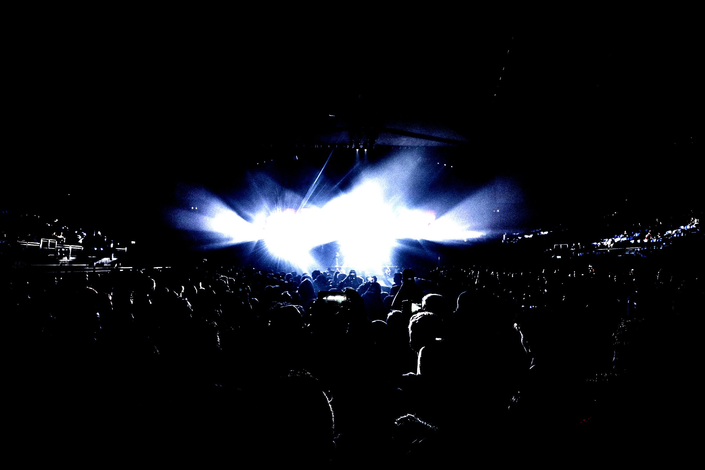 Crowd Watching Show Inside the Dark Stadium